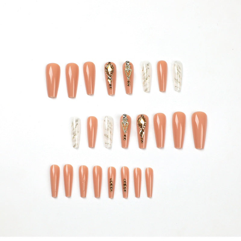 Artful nail extensions with glitter embellishments and delicate accents Stornfield