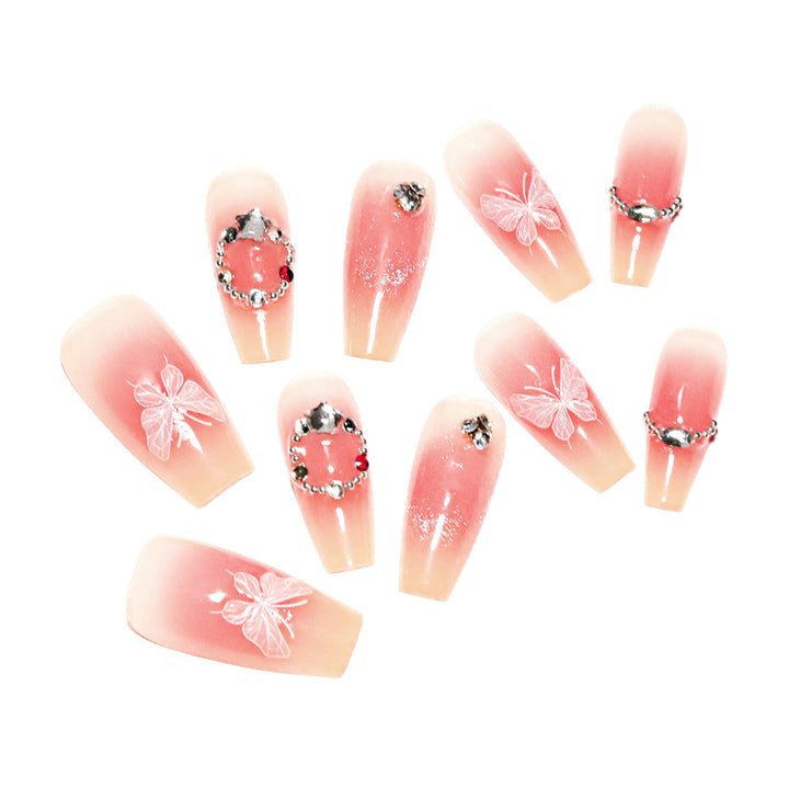 Artificial nail extensions with floral design and sparkling accents Stornfield