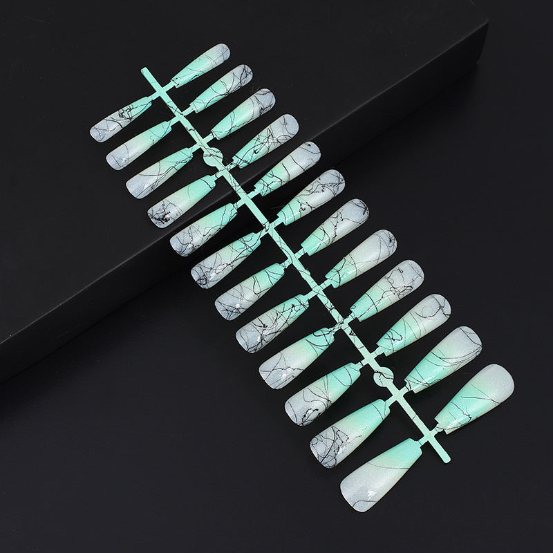 Artificial nails in modern ombre design with marbled accents Stornfield