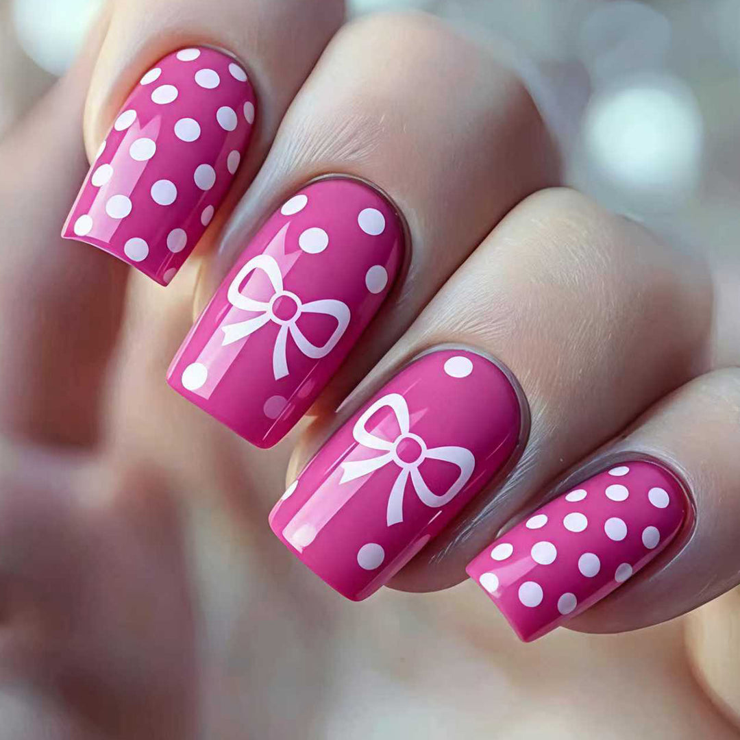 Artificial nails with romantic polka dot pattern and bow Stornfield