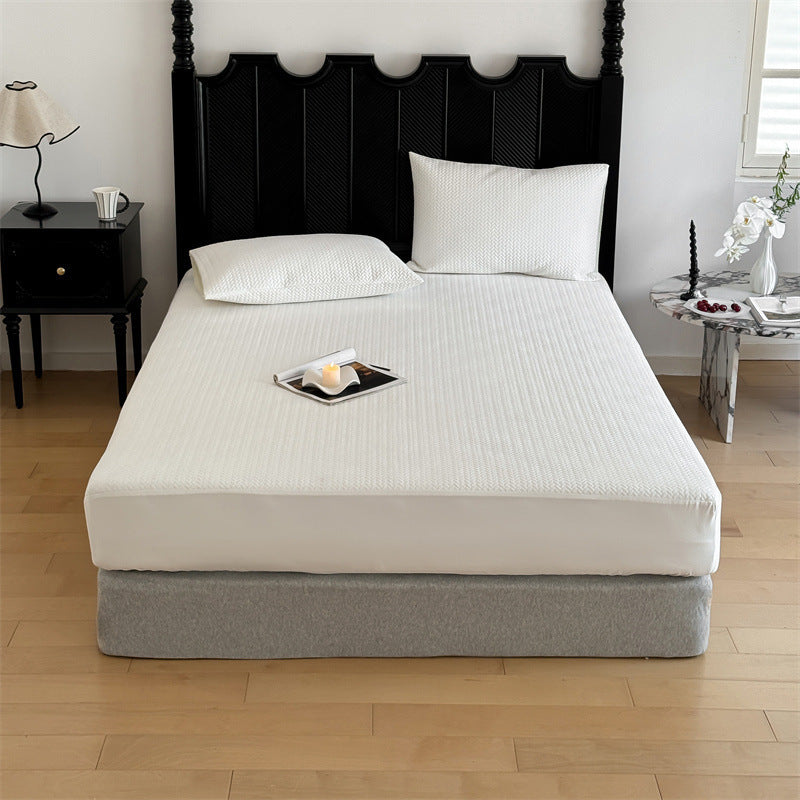 Comfort mattress topper with textured waffle surface and deep edge