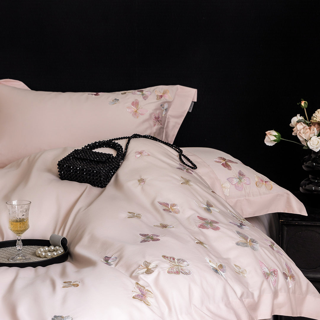Premium bedding set made of extra soft cotton satin with delicate butterfly embroidery and concealed hotel closure