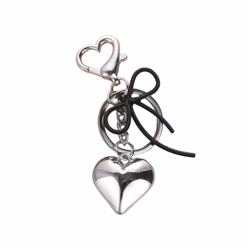 Heart-Shaped Metallic Keychain with Decorative Bow Stornfield