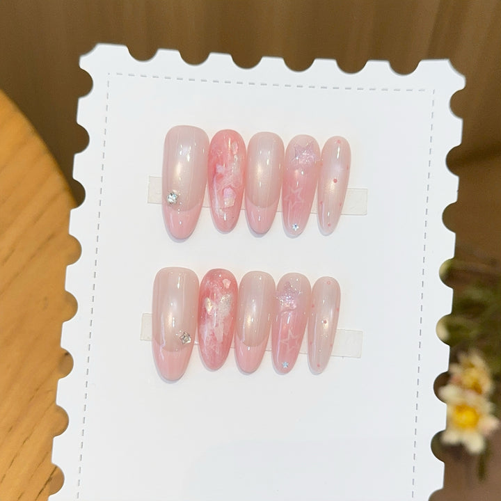 Artificial nails with delicate glitter and star motifs Stornfield