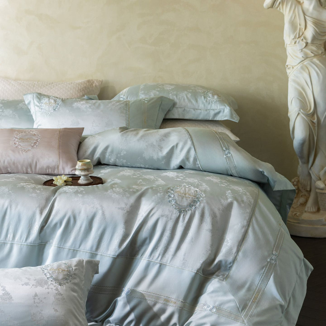 Luxurious satin bedding set with embroidered medallions and elegant quilting