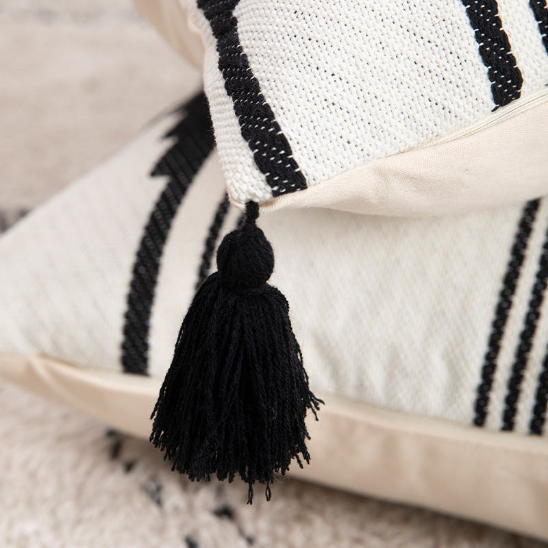 Rectangular Jacquard lumbar cushion cover with geometric ethnic relief and decorative tassels Stornfield