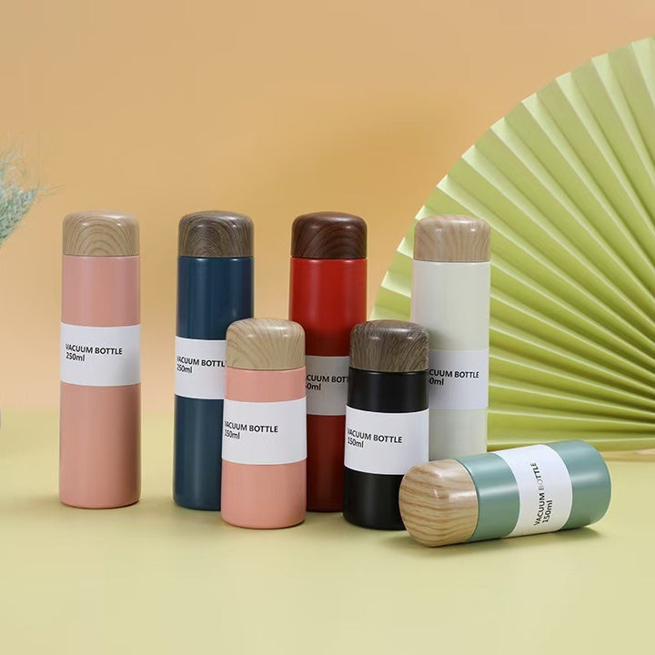 Women vacuum-insulated water bottle with innovative wooden lid Stornfield