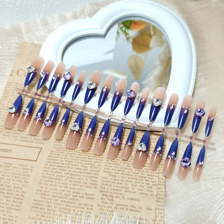 Artificial nails with elegant glitter design and 3D rhinestone accents Stornfield