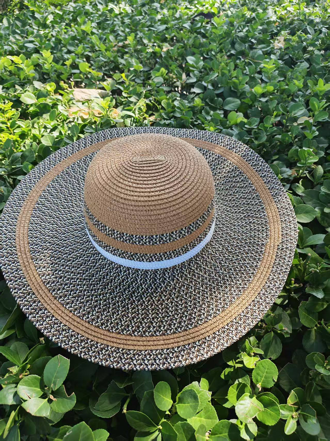 Elegant sun hat with wide brim and subtle stripe pattern Stornfield