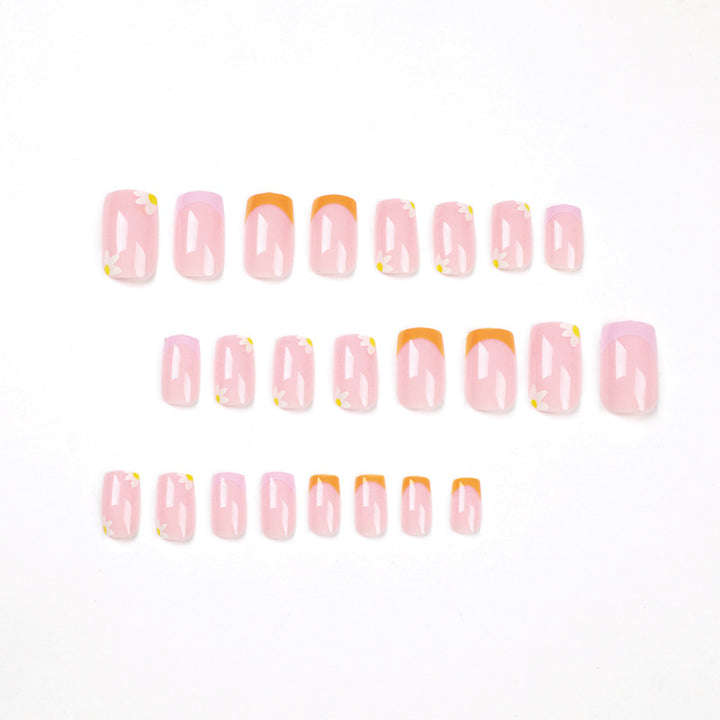 Artistic acrylic nails with floral design and creative color accents Stornfield
