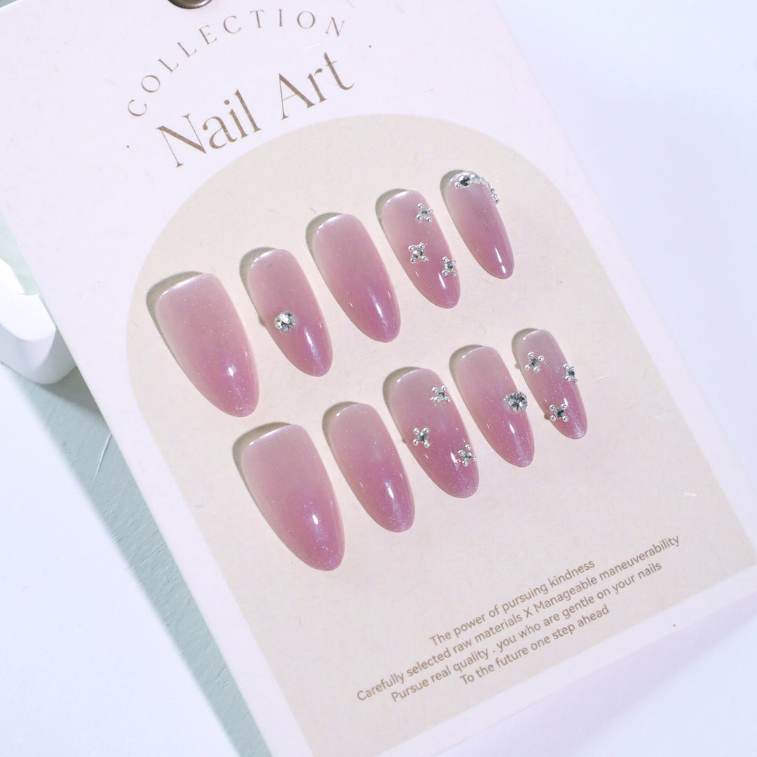 Artificial nail art with glitter embellishments Stornfield