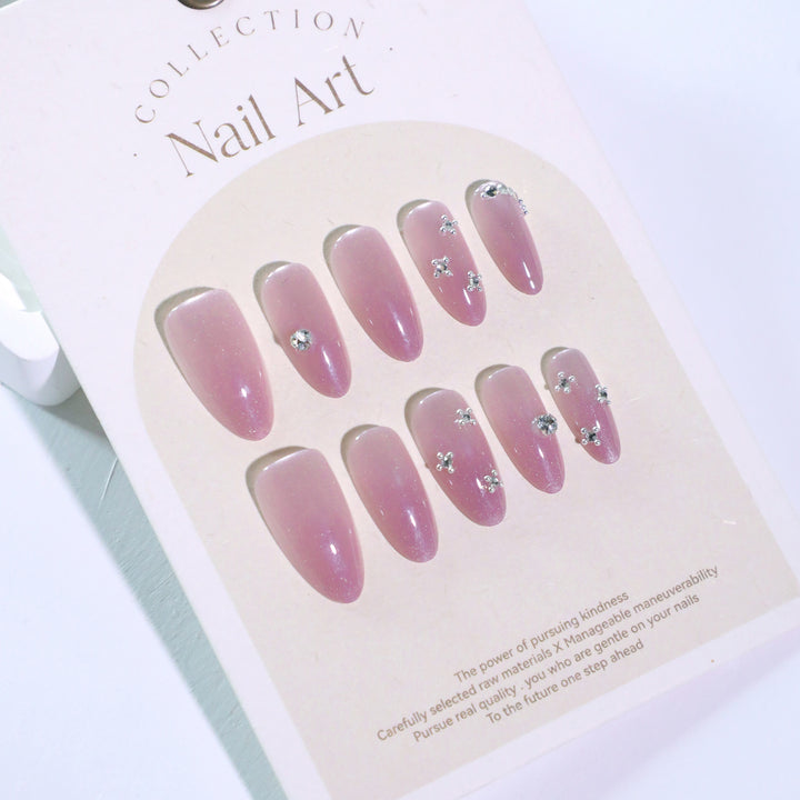 Artificial nail art with glitter embellishments Stornfield