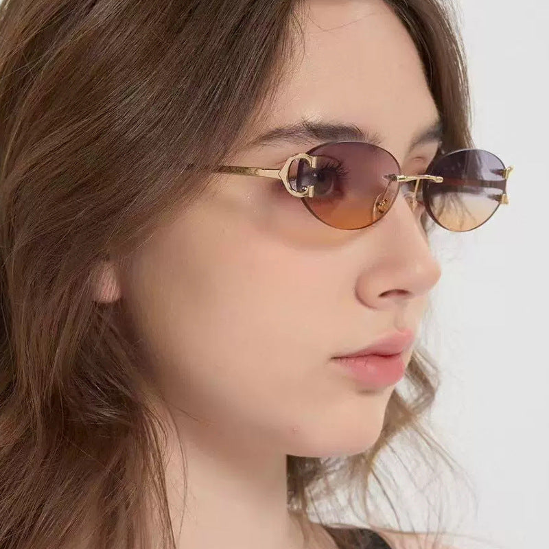 Women's elegant oval-shaped sunglasses with fashionable metal frame Stornfield