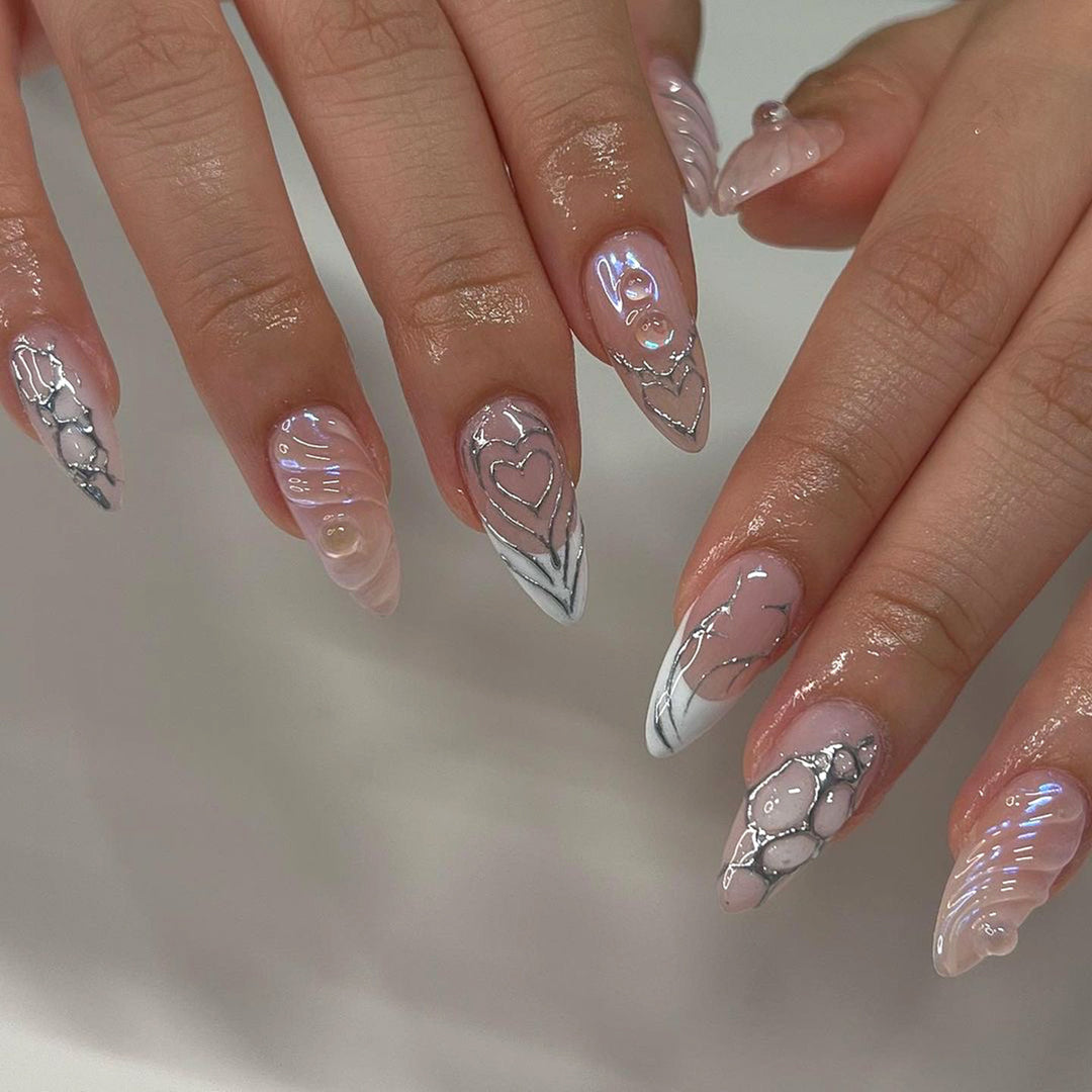 Elegant Stiletto Nail Extensions with Decorative Silver Accents Stornfield