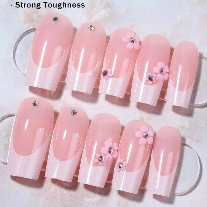 Artificial nail set with elegant 3D flowers and glamorous rhinestone accents Stornfield