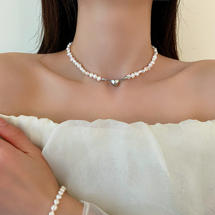 Elegant silver pearl bracelet with heart details Stornfield