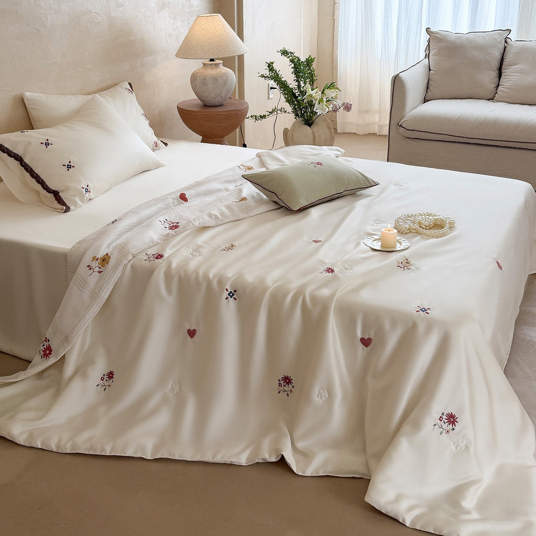 Elegant satin bedding set with fine floral embroidery and lace trim