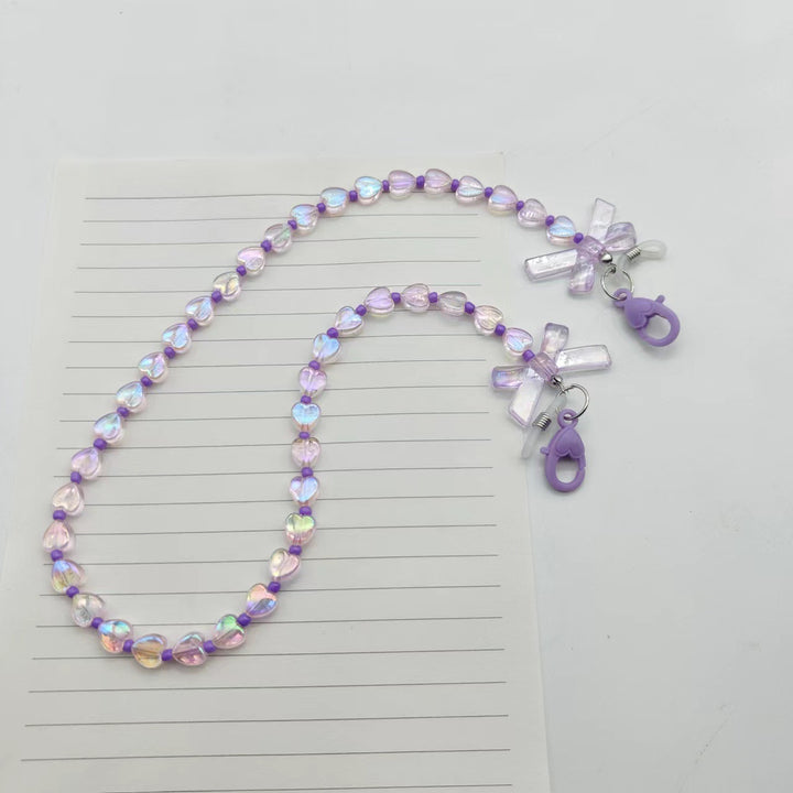 Fashionable glasses holder chain with heart and flower motifs Stornfield