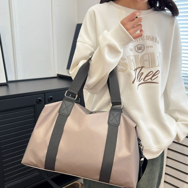 Athletic travel bag made of weather-resistant material with adjustable carrying handles Stornfield