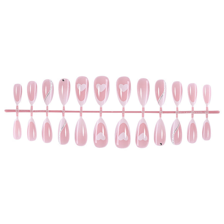 Acrylic nail set with romantic heart and glitter accents Stornfield