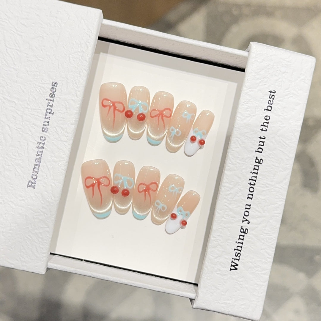 Artificial nail tips with romantic bow and cherry motifs Stornfield