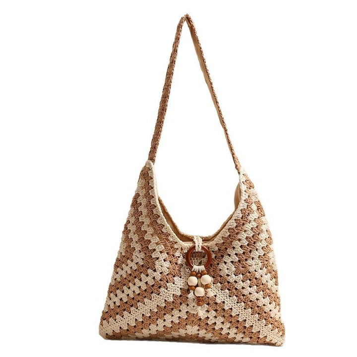 Handmade macrame shoulder bag with playful pendant Stornfield