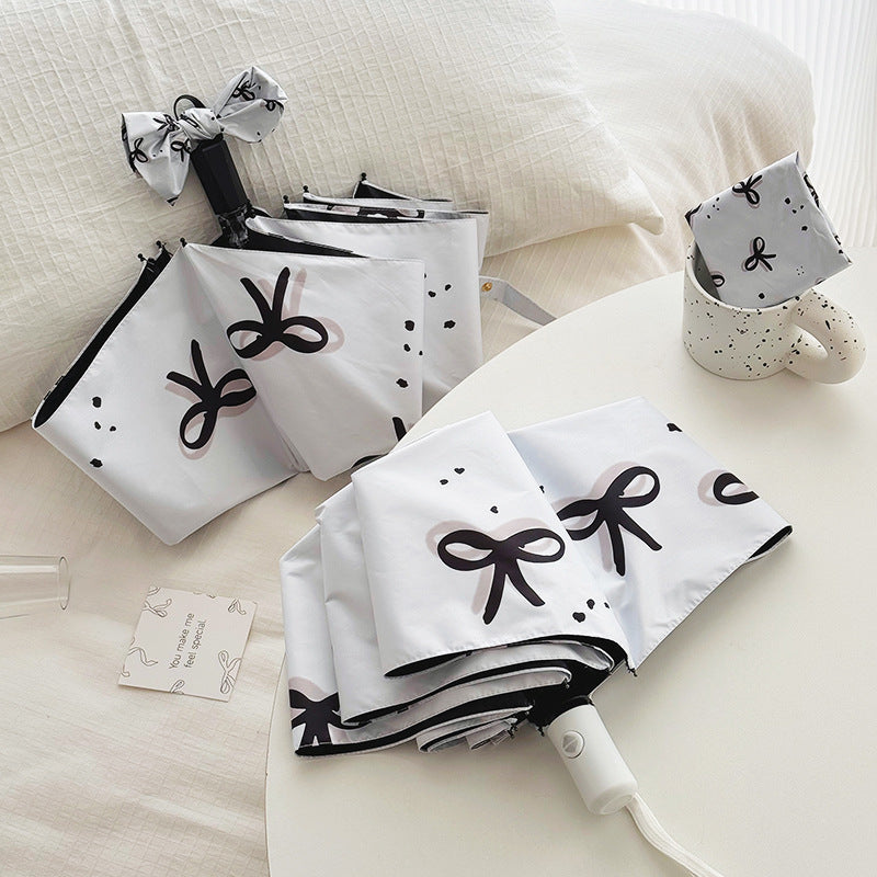 Women’s Folding Umbrella with Playful Bow Pattern Stornfield