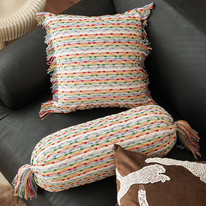 Cozy cushion set made of woven cotton blend with cylindrical roll and tassels Stornfield