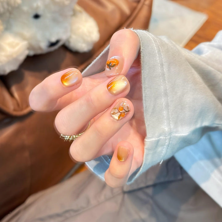 Artificial nails in elegant ombre look with floral accent Stornfield