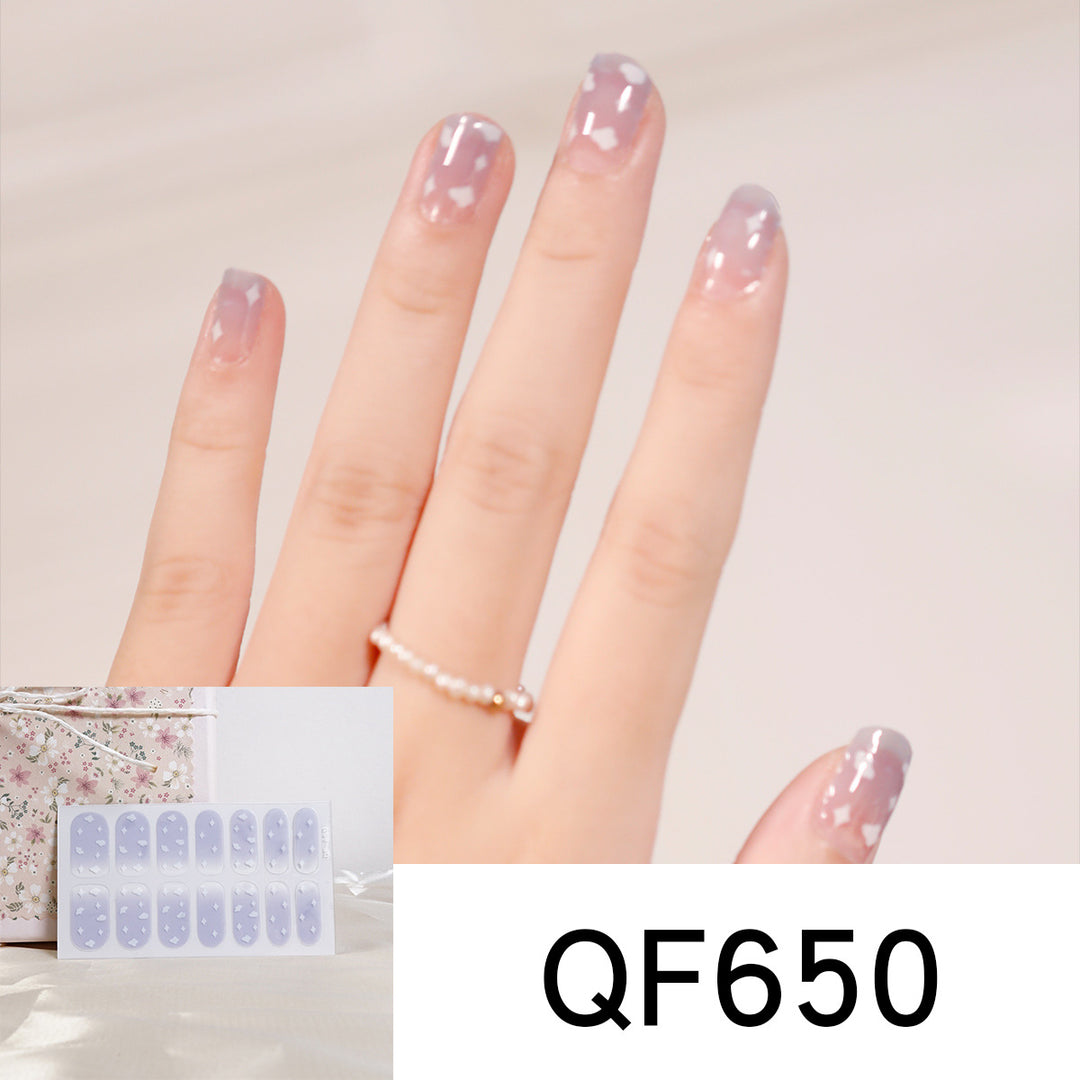 Artificial nail art with heart-shaped designs and soft color gradients Stornfield