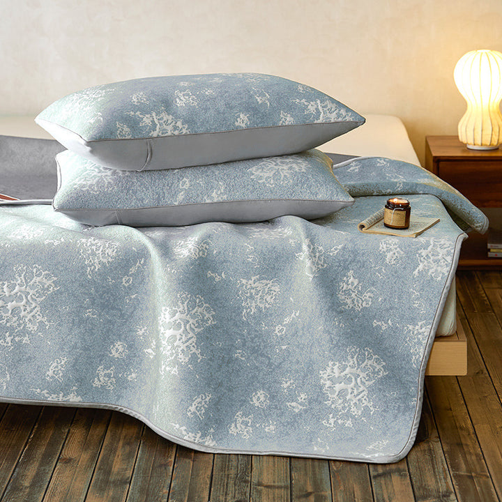 Quilted microfiber mattress pad with non-slip bottom and floral jacquard surface