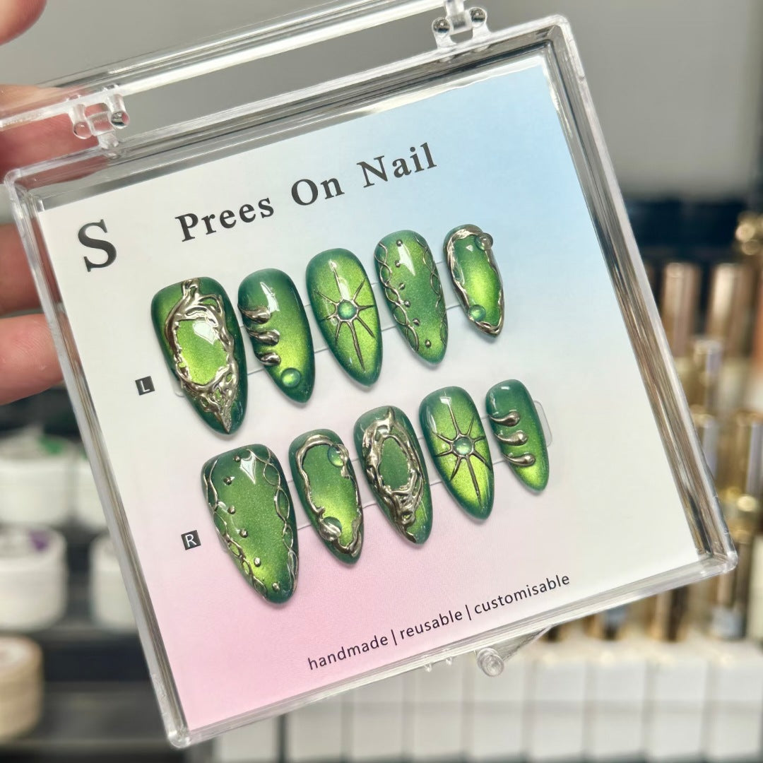 Artistic Press-On Nail Set with Unique Metallic Accents