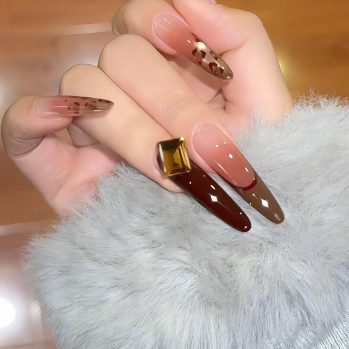 Artificial nails with elegant glitter and gold accent design Stornfield