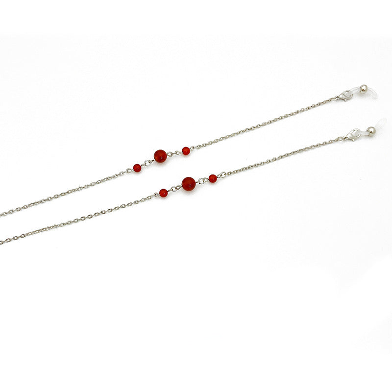 Elegant jewelry holder chain with red accents Stornfield