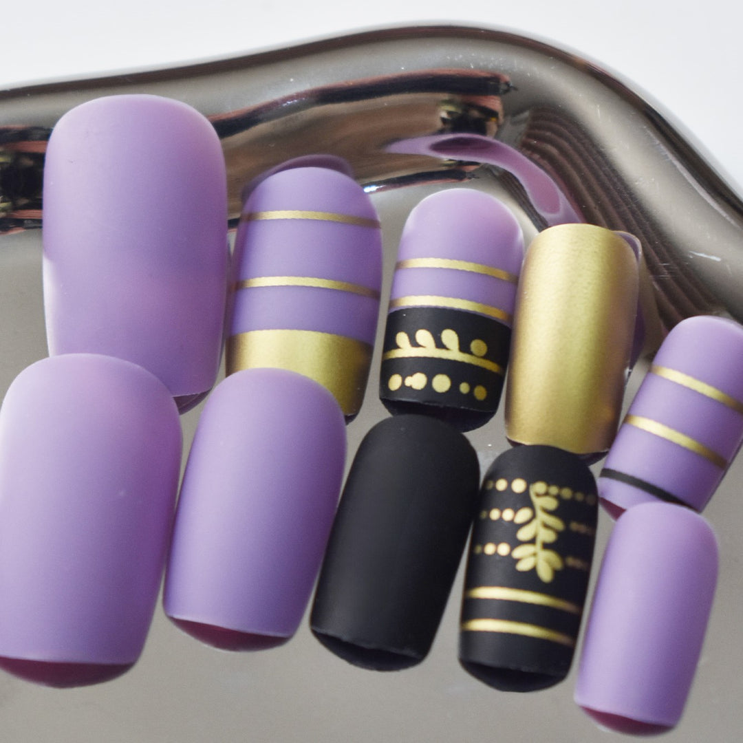 Trendy Press-On Nail Art with Decorative Gold Accents Stornfield