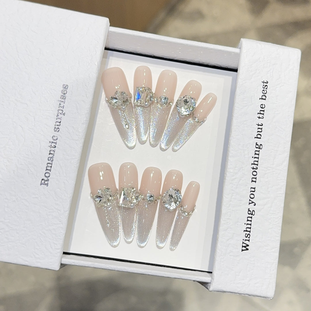 Glamorous artificial nails with sparkling rhinestone embellishments Stornfield