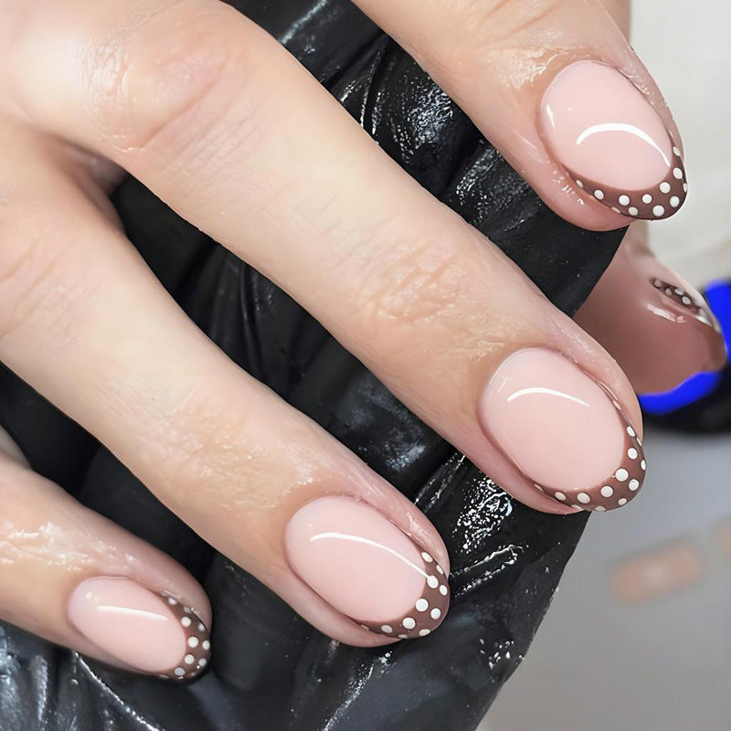 Artificial nail set with elegant French tips and subtle dots Stornfield