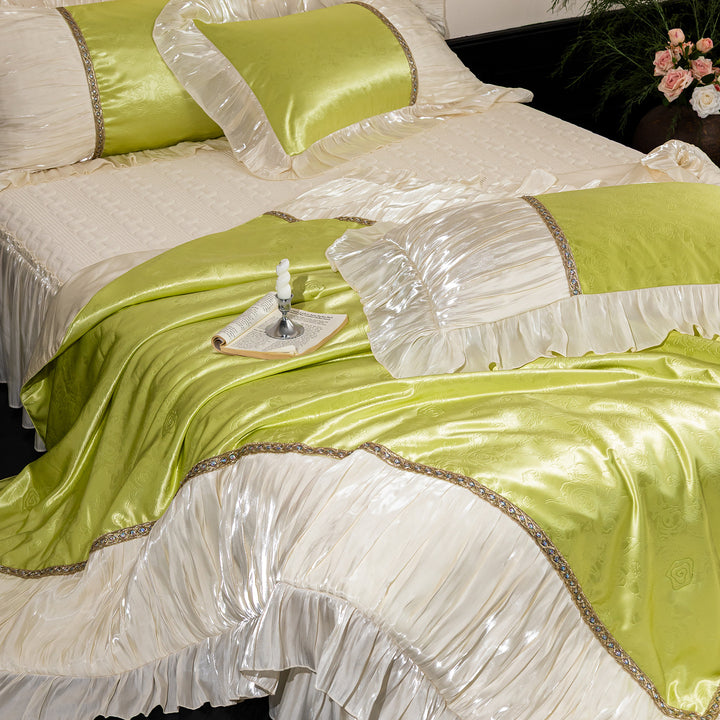 Opulent ruffled bedspread and pillow set made of satin with decorative border