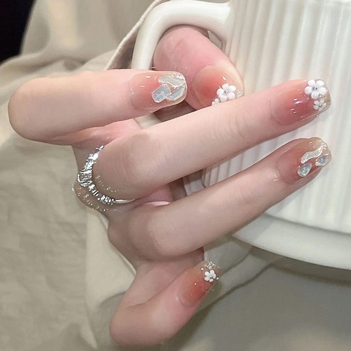 Artificial nail set with floral 3D decorations and elegant glitter Stornfield