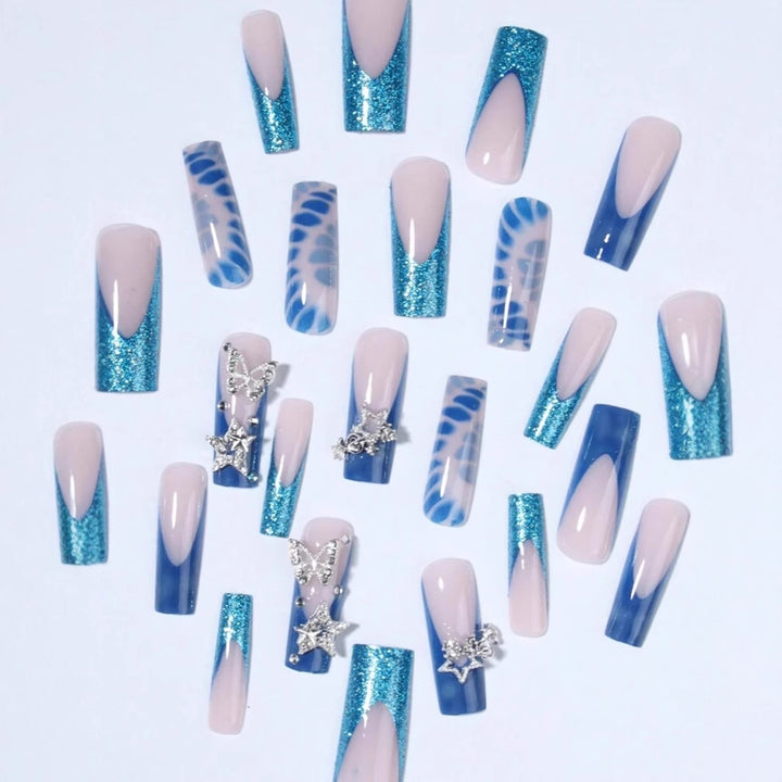 Glamorous artificial nail tips with adorned stars and glitter Stornfield