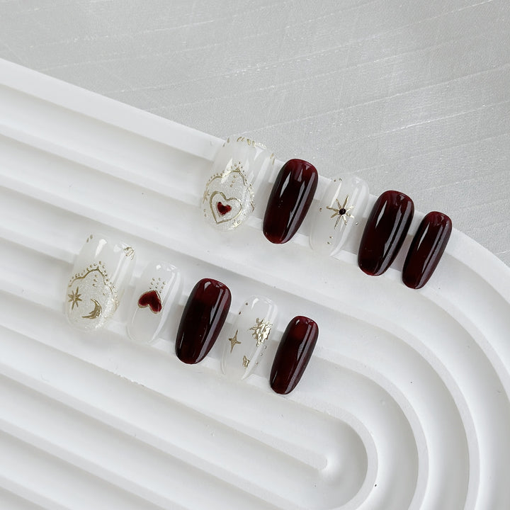 Artistic Press-On Nail Art Set with Heart and Celestial Designs
