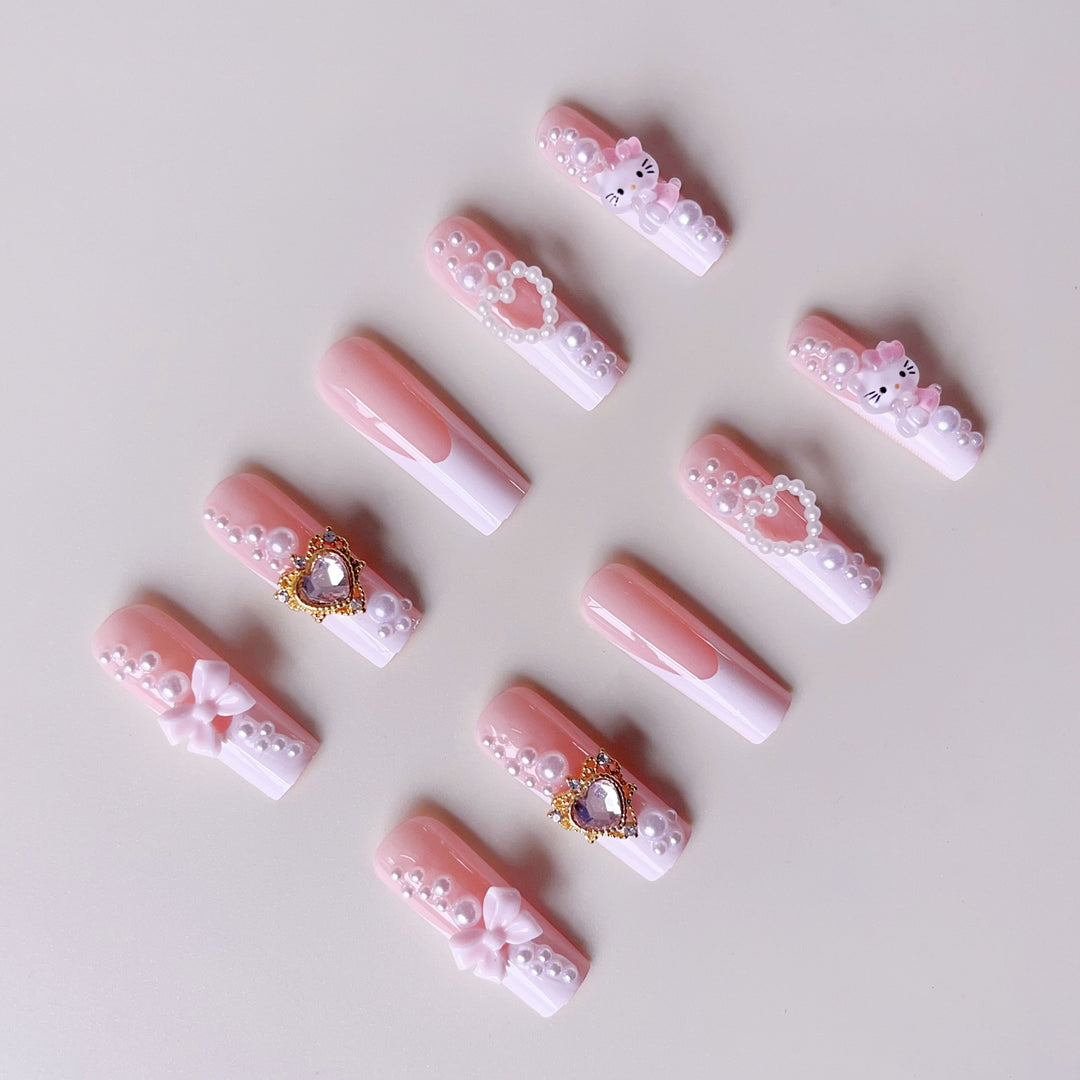 Glamorous artificial nails with 3D decorations and pearl accents Stornfield