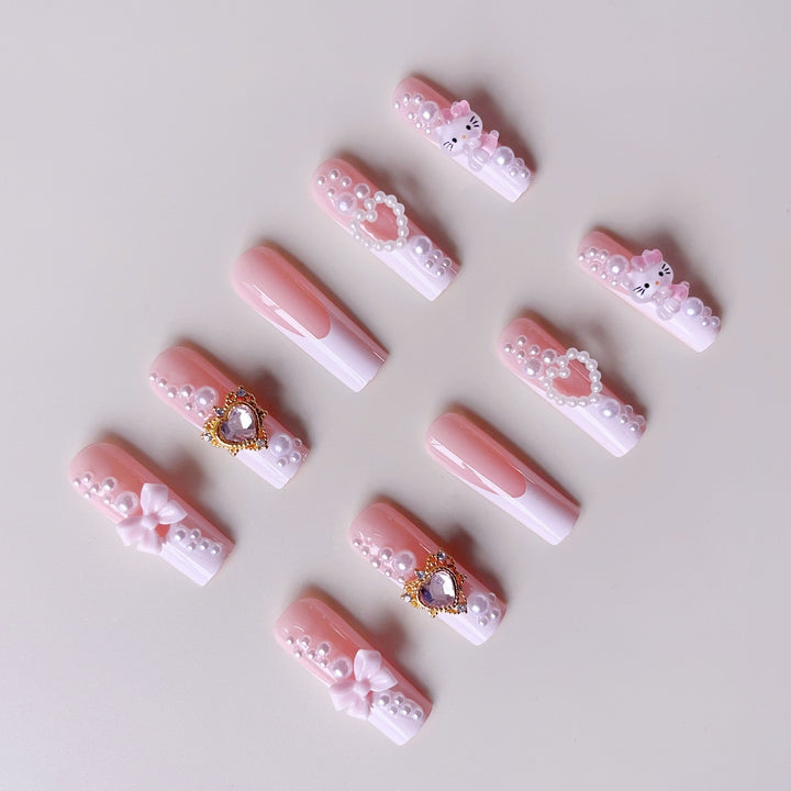 Glamorous artificial nails with 3D decorations and pearl accents Stornfield
