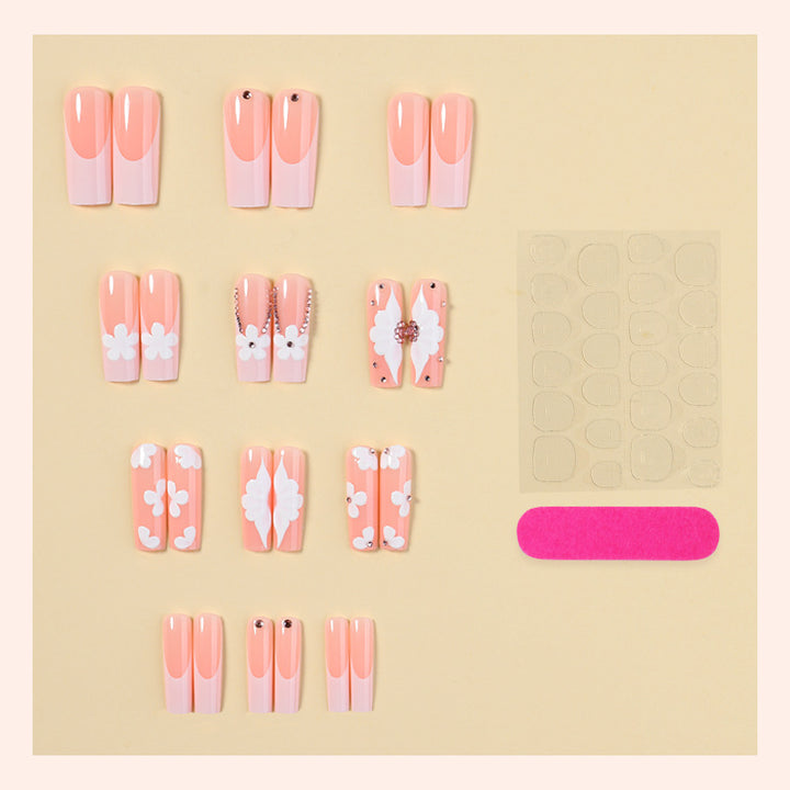Artificial nail set with delicate flower and glitter details Stornfield