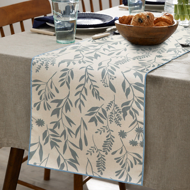 Woven table runner and placemat set made of cotton-linen with botanical scrolling pattern