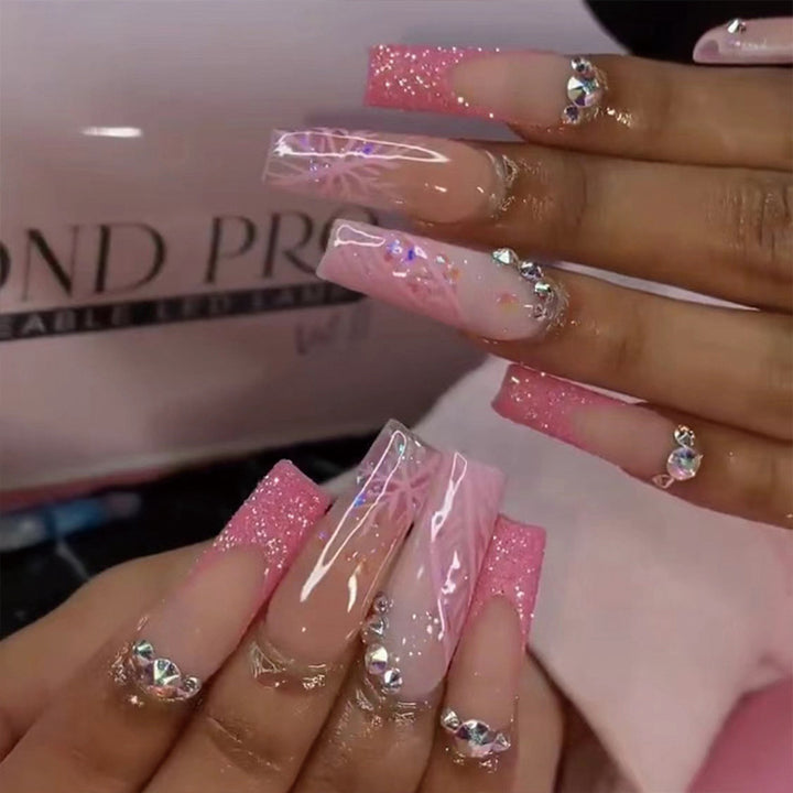 Artistic stiletto nails with glitter and snowflake design Stornfield