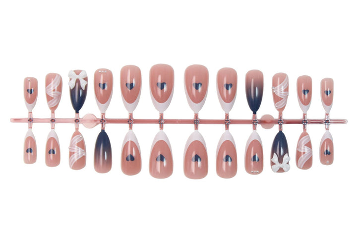 Artificial nail set with elegant bows and heart-shaped accents Stornfield
