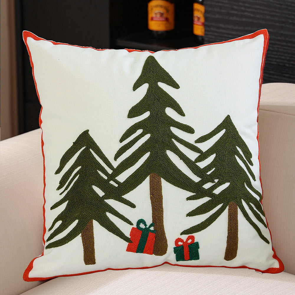 Decorative cushion cover with festive Christmas star print and pom-pom trim Stornfield