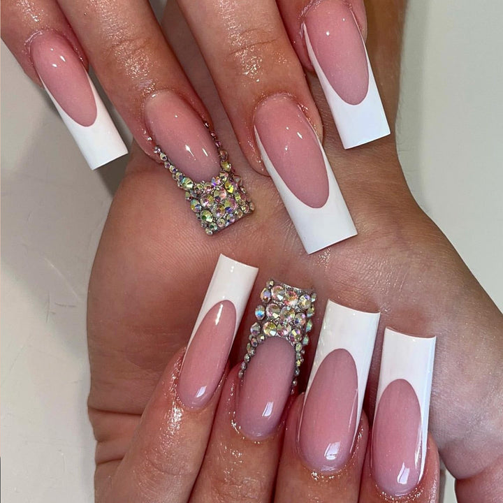 Acrylic nail set with filigree accents and glitter embellishments Stornfield