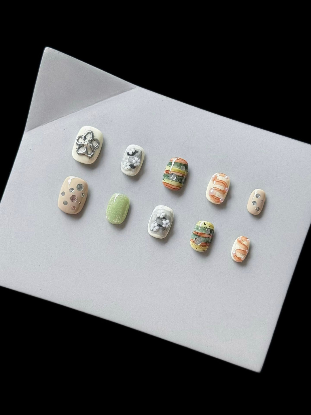 Artistic Press-On Nail Set with Floral and Textured Designs